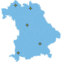 Eine blaue Bayern-Karte. Auf der Karte sind die 5 LANDSTADT-Modellgemeinden in Phase 3 als gelber Stern eingezeichnet.
